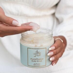 Naturally luxurious White Musk Body Sugar Scrub by House of Soap being scooped out by hand